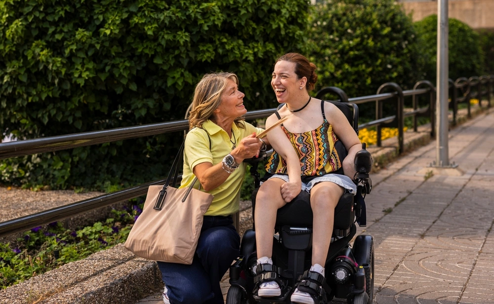 Woman taking care of a disabled woman